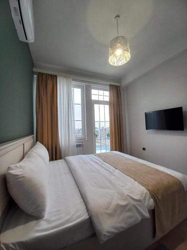 Postel nebo postele na pokoji v ubytování Grey House
