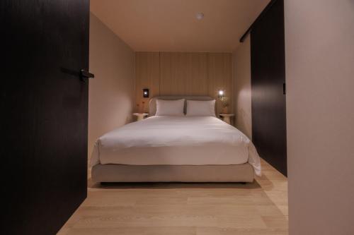 Ένα ή περισσότερα κρεβάτια σε δωμάτιο στο Hotelarrive Euljiro Tum