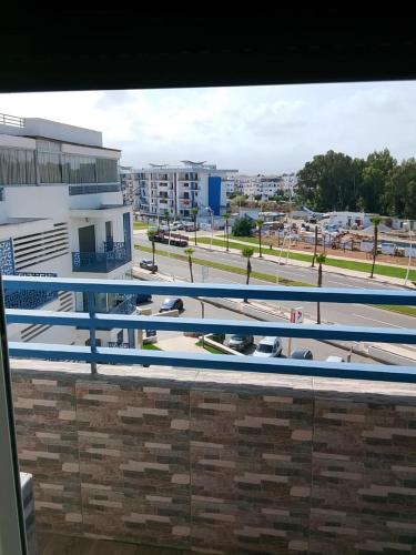 a view of a swimming pool from a building at Martil Playa Haut standing in Martil