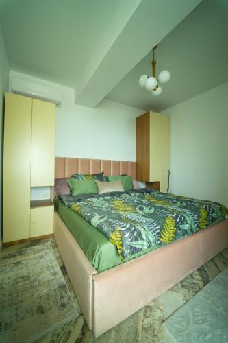 a bedroom with a large bed in a room at CristAlex Sunset in Constanţa