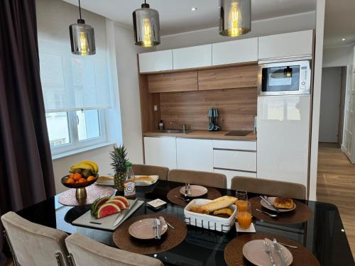 a kitchen with a table with food on it at Hélios Plage in Berck-sur-Mer