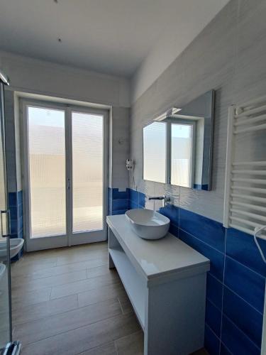 a bathroom with a sink and a mirror at Brezza Marina in Massa Lubrense