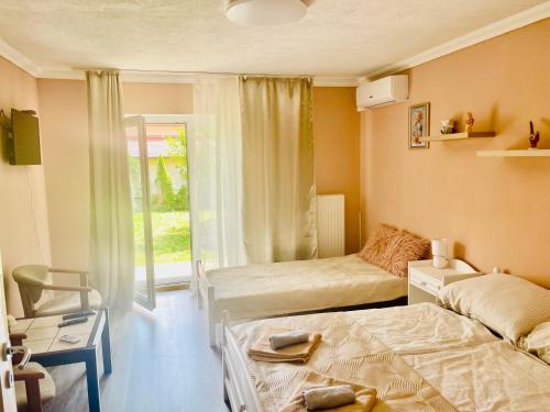 Postel nebo postele na pokoji v ubytování Villa Lux