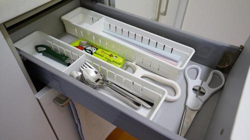 a drawer with scissors and other kitchen utensils in it at 1min to Nakajima Park, max 6 ppl, 2LDK, 2 double bed, 1 sofa bed, Sapporo in Sapporo