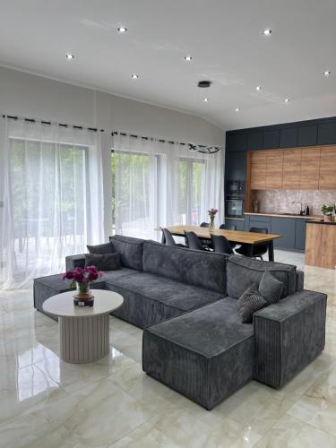 a living room with a couch and a table at Podhorský Apartmány Terchová in Terchová