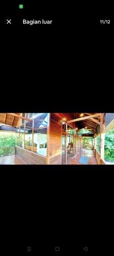 two pictures of a building with at Wooden studio gem in Mantaak