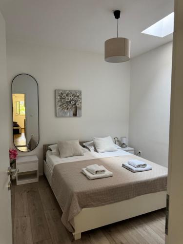 Posteľ alebo postele v izbe v ubytovaní Laganini Apartments