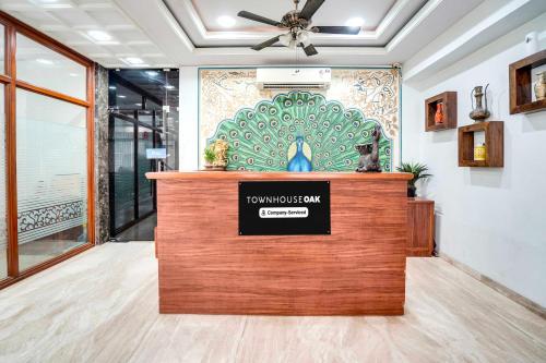 a lobby with a no smoking sign on a counter at Townhouse Oak Durgapura Railway Junction in Jaipur