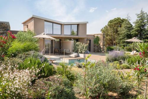 a house with a garden in front of it at Etheres in Nikiti