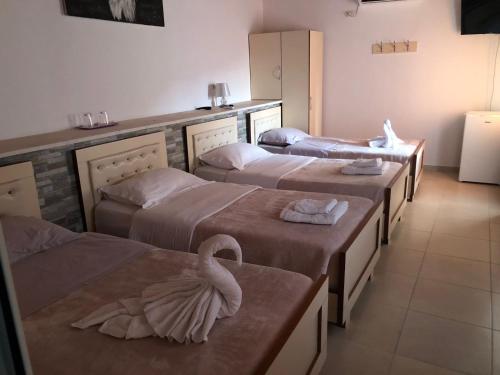 Postel nebo postele na pokoji v ubytování R HOTEL