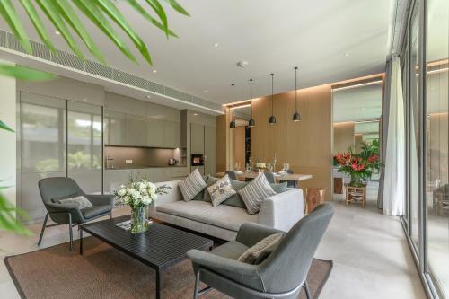 a living room with a couch and chairs and a table at JSD Prime Property-Kamala Beach in Surin Beach