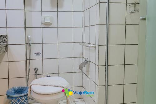 a bathroom with a toilet and a glass shower at DiRoma Exclusive Caldas Novas in Caldas Novas