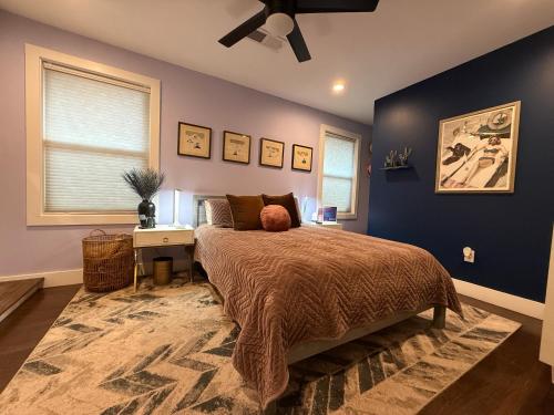 a bedroom with a bed and a desk in it at LUXE Designs by Nicole in Atlanta