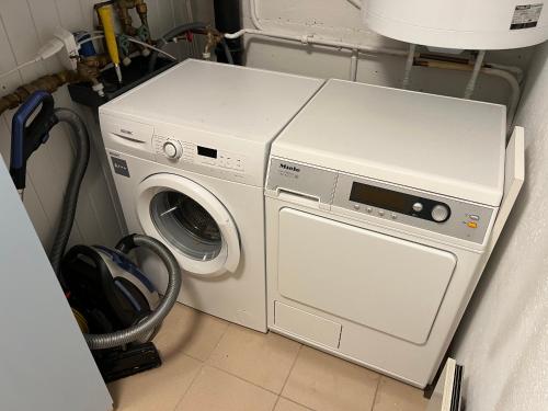 a washing machine and a washer in a room at Chalet Fava in Plan Fey