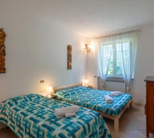 Ένα ή περισσότερα κρεβάτια σε δωμάτιο στο Villa Glicine