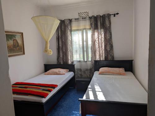 Postel nebo postele na pokoji v ubytování Dans place