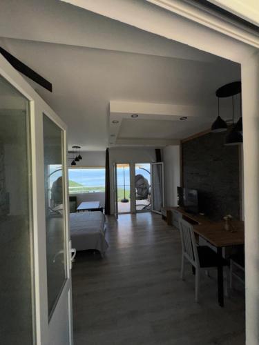 a bedroom with a bed and a desk and a table at Velestovo Panorama House in Velestovo