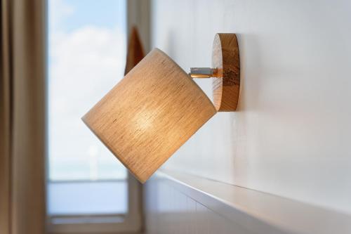 a piece of wood hanging on a wall at Appartementhaus Meeresburg in Norderney