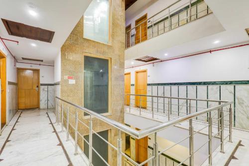 a hallway with a staircase in a building at Townhouse Oak Paharganj Delhi Railway Station in New Delhi