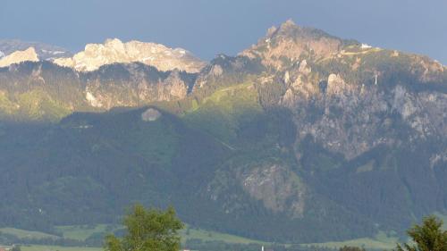 a view of a mountain range with mountains at Allgaeuer-Landhaus-Stocker in Hopferau