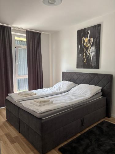 Postel nebo postele na pokoji v ubytování Vibes-city apartman