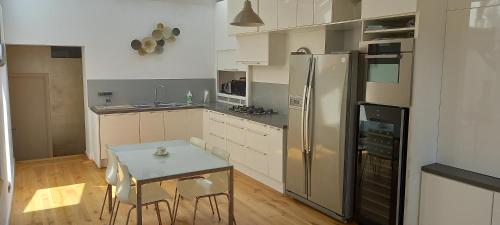 Kjøkken eller kjøkkenkrok på Panorama Vue Penthouse