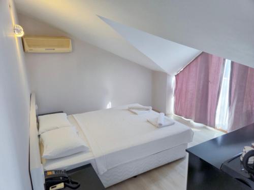 Katil atau katil-katil dalam bilik di Habesos Hotel