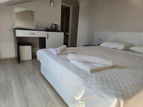 Katil atau katil-katil dalam bilik di Habesos Hotel