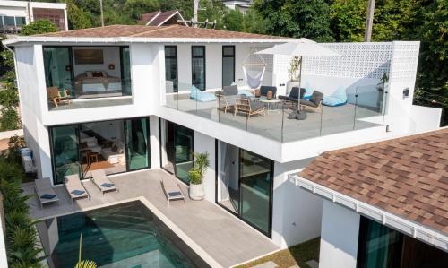 an aerial view of a house with a swimming pool at The Guu Villas - Luxe Seaview Villa Resort in Ko Lanta