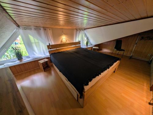 an overhead view of a bedroom with a large bed at Ferienhaus Marx in Sebnitz