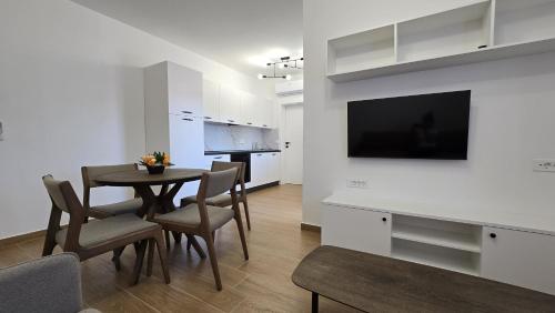 a kitchen and dining room with a table and chairs at Apartments Tota in Starigrad-Paklenica