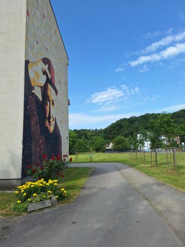 a mural of a cow on the side of a building at STUDIO APARTMAN MARKo C self-check in,frre parking in Karlovac