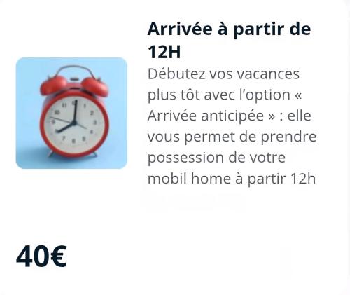 - un réveil rouge assis au-dessus d'une table dans l'établissement Grands mobil-homes 4 chambres clim-parking privées-possibilité d'accueil jusqu'à 20 voyageurs-Siblu, à Gastes