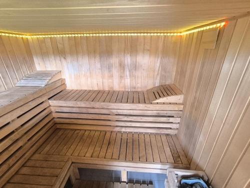 a small sauna with a bed in the middle at Chata w lesie in Zagwiździe
