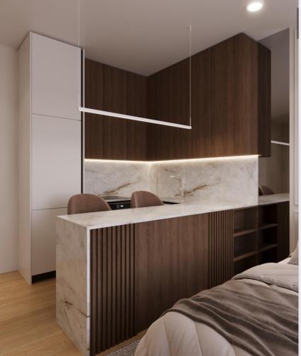 Un dormitorio con una cama y armarios de madera. en Villa Orange Coast, en Durrës