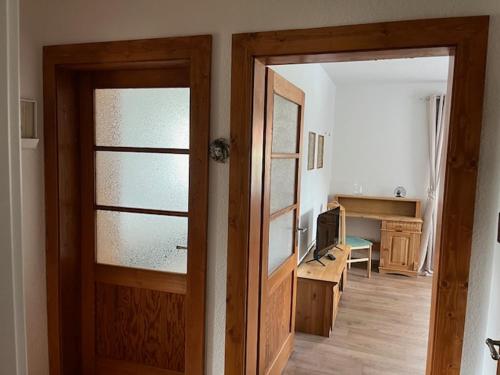 a room with a door open to a living room at Ferienwohnung an der Rosenstraße in Stadt Wehlen