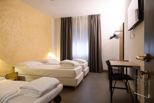 Postel nebo postele na pokoji v ubytování Hotel Due Ragni e Ristorante