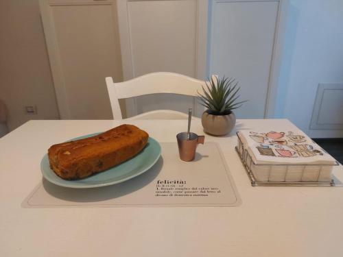 a table with a plate with a loaf of bread on it at Profumo di Bosco in Spoleto