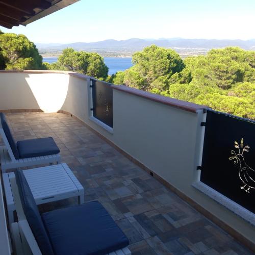 a balcony with a view of the water at Casa Dora in Porto Pino