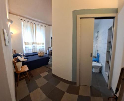a room with a door open to a living room at Aghinas in Bosa
