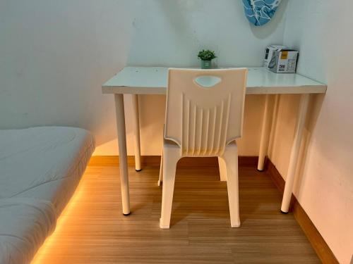 a chair sitting at a desk in a room at Luxury 2BR at Heart of Melaka in Melaka
