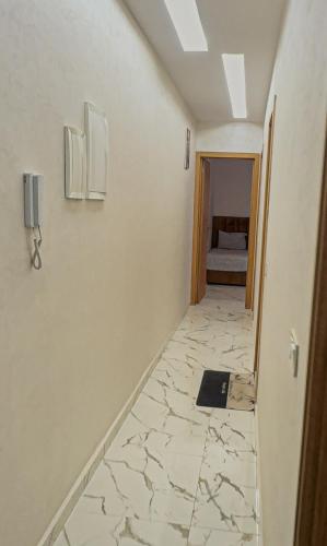 a hallway of a room with a floor of marble at The gray pearl in Agadir