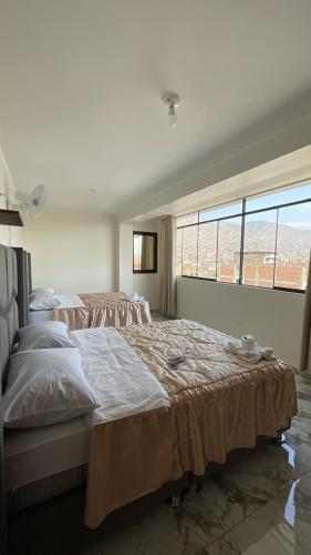 Katil atau katil-katil dalam bilik di Hostal El Encanto