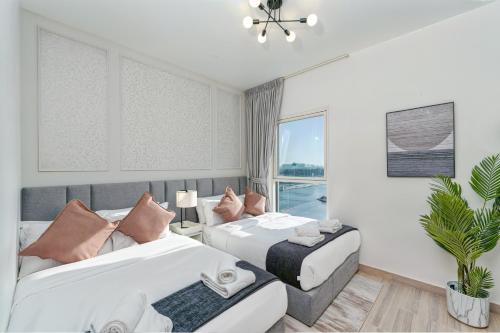 Ein Bett oder Betten in einem Zimmer der Unterkunft Desert Key - Perfectly Located Yas Island Premier Apts