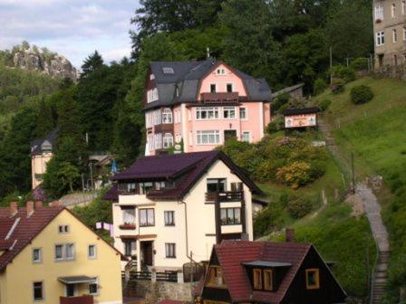 a group of houses on the side of a hill at Haus 'Annelies' in Kurort Rathen