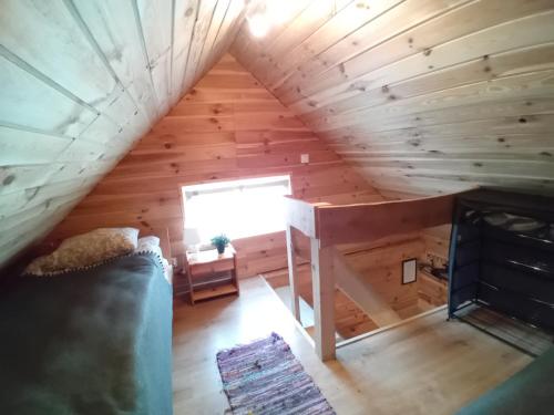 a view from the loft of a tiny house at Zakątek Włóczykija in Cisna