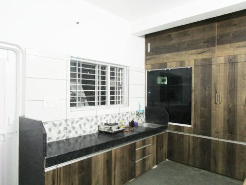 a bathroom with a sink and a window at 1 BHK Bedroom Apartment ,Couple Friendly in Belgaum