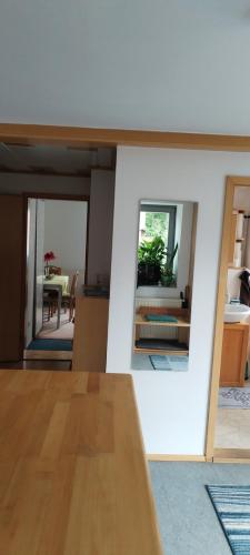 a living room with a table and a dining room at Zimmer bei Nürnberg in Heroldsberg