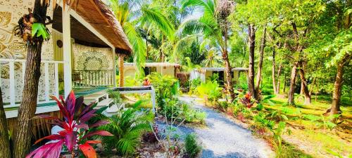 a house with a path leading to a garden at Secret Palm in Koh Phangan