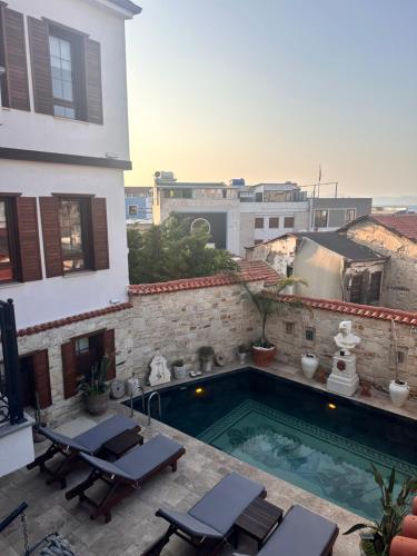a swimming pool on the side of a building at Villa Ephesus Hotel in Kusadası